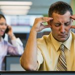 Businessman Irritated with Loud Coworker